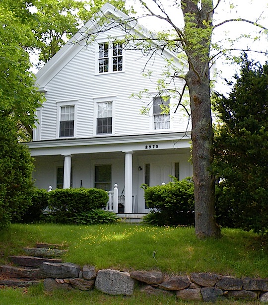 White clapboard antique house in Barnstable, Cape Cod, MA