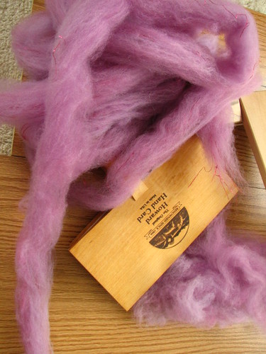 Purple roving that was dizzed off the drum carder