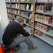 John Green takes a quick photo of Maureen Johnson's books on our shelves, The Key to the Golden Firebird