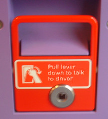 Lever marked 'pull down lever to talk to driver' (flickr)