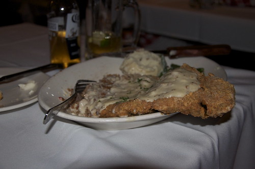 Mom ordered the most ENORMOUS chicken fried steak. And shes convinced shes going to carry the leftovers in a doggie back all the way up the Central Valley and back to San Francisco!