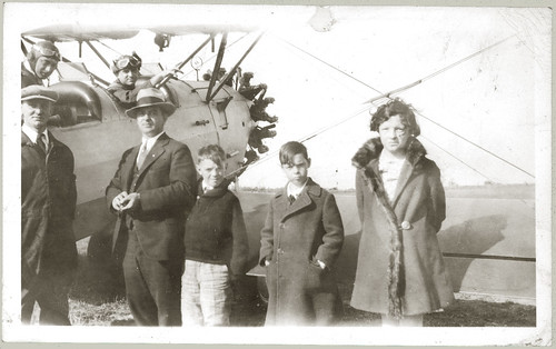 Biplane and seven people