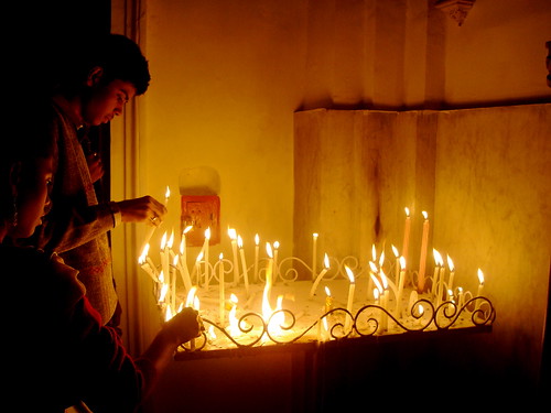 Lighting Candles on Christmas at a Church in Kolkata