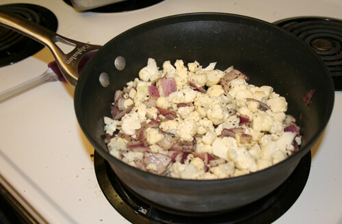 Add cauliflower, stir, and cover.