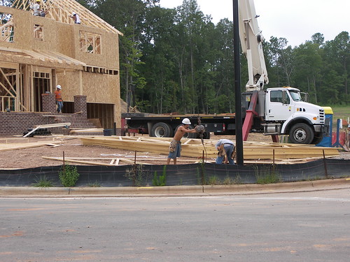Putting trusses on a newly framed home