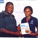Adekunle Babatunde collects his Java programming book from Doyin of Jidaw.com at the FREE IT Career Seminar for January 2009 in Lagos, Nigeria