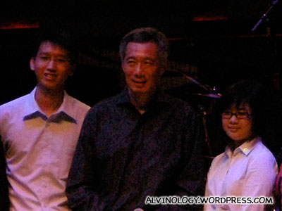 Close-up of PM Lee and two students who volunteered to go on stage