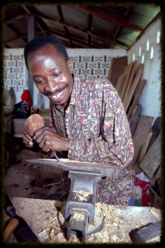 Togo West Africa Ethnic Cultural Wood Carvings Palimé formerly known as Kpalimé is a city in Plateaux Region Togo near the Ghanaian border 23 April 1999 002 African Wood Craft Worker<br/>© <a href="https://flickr.com/people/41087279@N00" target="_blank" rel="nofollow">41087279@N00</a> (<a href="https://flickr.com/photo.gne?id=3278168278" target="_blank" rel="nofollow">Flickr</a>)