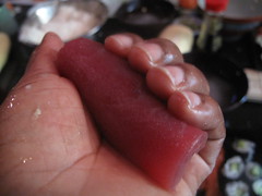 tuna roll between hands to mould