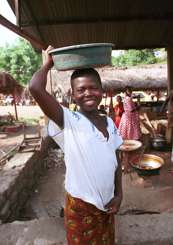 Togo West Africa Village Market Togolese lady Vendor close to Palimé formerly known as Kpalimé a city in Plateaux Region Togo near the Ghanaian border 24 April 1999 000<br/>© <a href="https://flickr.com/people/41087279@N00" target="_blank" rel="nofollow">41087279@N00</a> (<a href="https://flickr.com/photo.gne?id=3237867084" target="_blank" rel="nofollow">Flickr</a>)