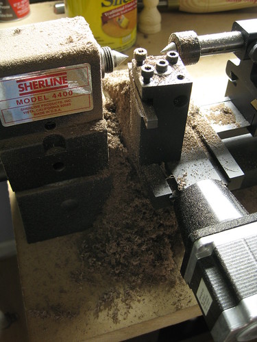 walnut wood dust on my Sherline 4400 CNC mini lathe after cutting 32 short, 1/4