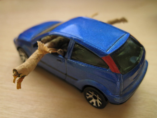 toy '00 Ford Focus hatchback with tiny logs