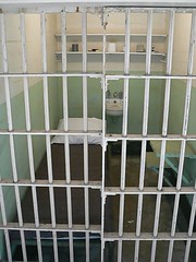 Prison cell with bed inside Alcatraz main buil...