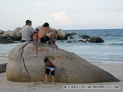 Ang moh family enjoying the sea breeze and view