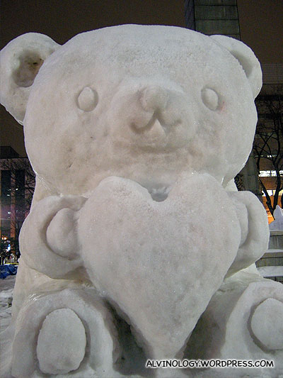 Cute-looking bear with a heart