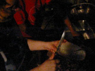 20040701-05 - 4th Of July at Eric Axilbund's - 101-0102 - Carolyn cleaning a fish - just before cutting her finger (16s) (mjpeg) (20fps) (mono snd)