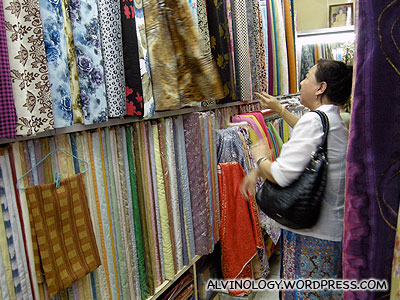 My mom buying some textiles