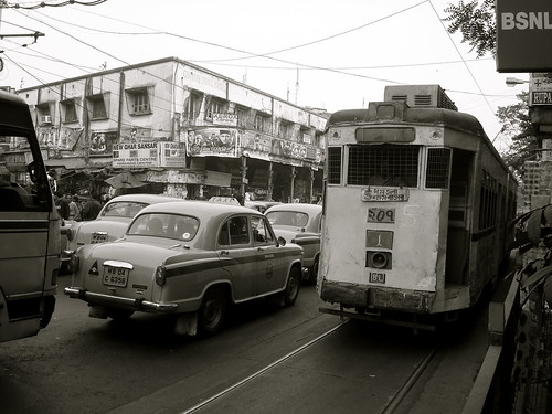 Typical Kolkata - Yellow Taxis and Tram