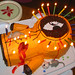 20090124 - Clints 35th Birthday Party - cake - Tabbithas Kenny Cake - lit - close-up - side tilt - 175-7551 - Kenny with candles