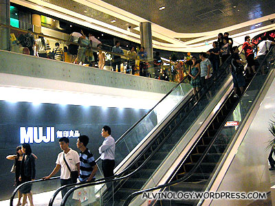 Muji store besides the escalator