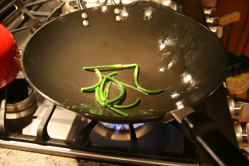 garlic scapes in wok