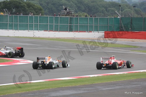Sergio Perez, Paul Di Resta and Fernando Alonso in Free Practice 2 at the 2013 British Grand Prix