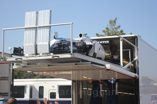 A Williams car being offloaded from a truck at Formula One Winter Testing