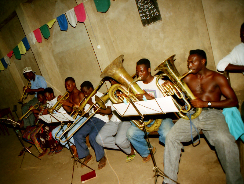 Togo West Africa Local Ethnic Cultural Orchestra Band and Show African Village close to Palimé formerly known as Kpalimé a city in Plateaux Region Togo near the Ghanaian border 23 April 1999 044 Local Brass Band<br/>© <a href="https://flickr.com/people/41087279@N00" target="_blank" rel="nofollow">41087279@N00</a> (<a href="https://flickr.com/photo.gne?id=13906805146" target="_blank" rel="nofollow">Flickr</a>)