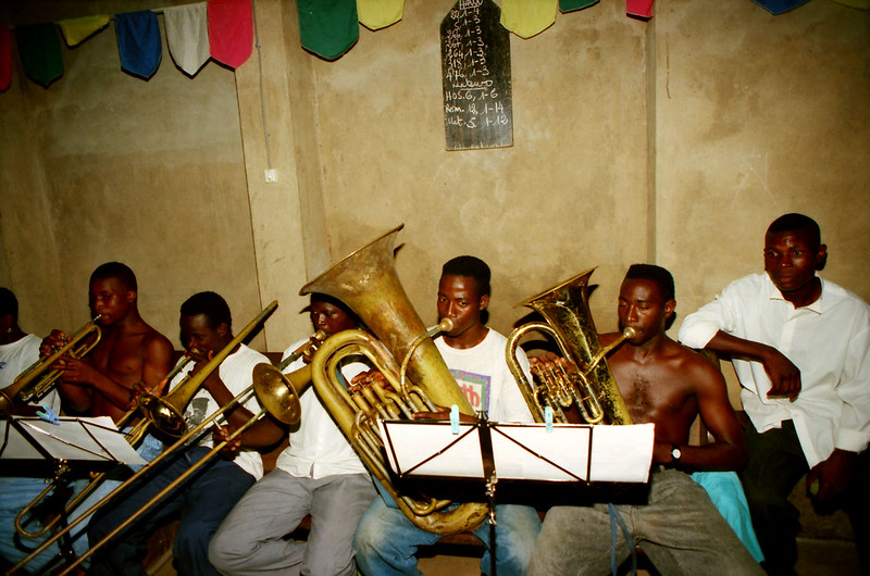 Togo West Africa Local Ethnic Cultural Orchestra Band and Show African Village close to Palimé formerly known as Kpalimé a city in Plateaux Region Togo near the Ghanaian border 23 April 1999 043 Local Brass Band<br/>© <a href="https://flickr.com/people/41087279@N00" target="_blank" rel="nofollow">41087279@N00</a> (<a href="https://flickr.com/photo.gne?id=13929978253" target="_blank" rel="nofollow">Flickr</a>)