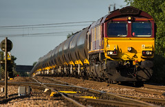 DB Class 66/0 no 66024 climbs the hill at Newark Flat Crossing on 21-06-2014 with a Kingsbury to Lindsey discharged oil tank train