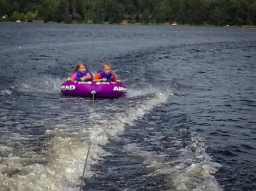 It is hard to take a good picture from a moving boat with an iPhone but here are Kai and Nora enjoying some tubing on Bass Lake. • <a style="font-size:0.8em;" href="http://www.flickr.com/photos/96277117@N00/14687828351/" target="_blank">View on Flickr</a>