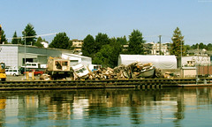 Piles of boats in junkyard by Chittenden Locks • <a style="font-size:0.8em;" href="http://www.flickr.com/photos/34843984@N07/15359433907/" target="_blank">View on Flickr</a>