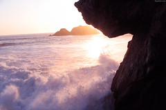 Sunset behind wave crashing onto beach rocks • <a style="font-size:0.8em;" href="http://www.flickr.com/photos/34843984@N07/15360997540/" target="_blank">View on Flickr</a>