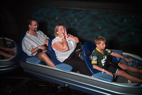 Space mountain during the Halloween celebration.  Note Kai making sure his candy doesn't fall out of the cart. • <a style="font-size:0.8em;" href="http://www.flickr.com/photos/96277117@N00/15531663705/" target="_blank">View on Flickr</a>