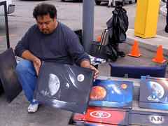 Artist holding up golden gate & star field painting • <a style="font-size:0.8em;" href="http://www.flickr.com/photos/34843984@N07/15360547740/" target="_blank">View on Flickr</a>